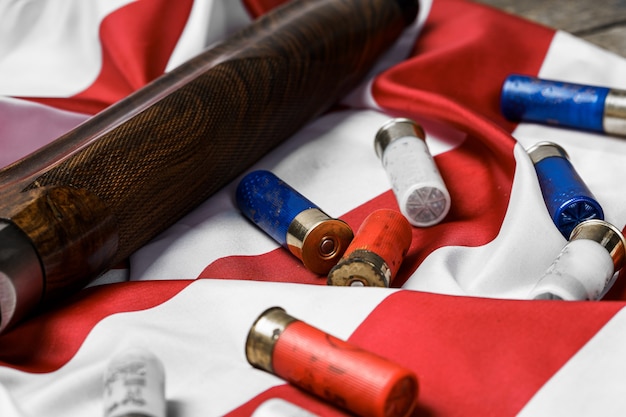 Automatic rifle on usa flag on wooden background