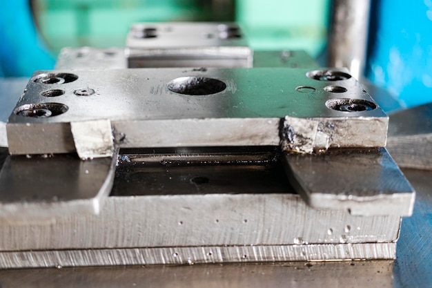 Automation hydraulic press stamping machine production line
industrial metalworking machines closeup of a hydraulic press in an
industrial workshop at a factory