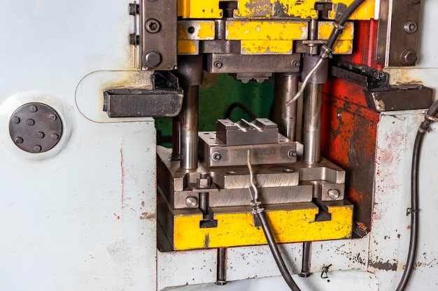 Automation hydraulic press stamping machine production line industrial metalworking machines Closeup of a hydraulic press in an industrial workshop at a factory