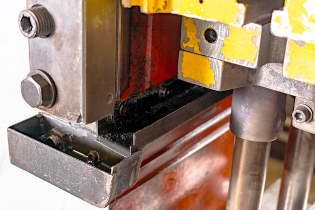 Automation hydraulic press stamping machine production line industrial metalworking machines Closeup of a hydraulic press in an industrial workshop at a factory