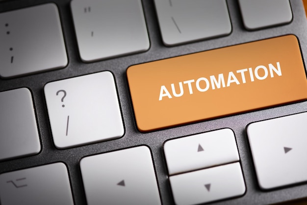 Automation text on computer keyboard background.