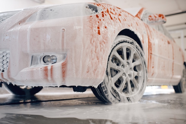 Automobile in foam, car wash service