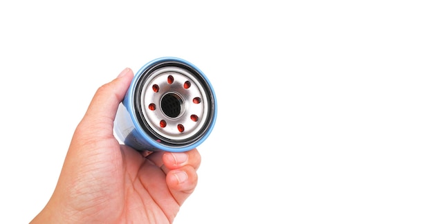 Automotive oil filter in a hand object isolated with clipping path and copy space on white background