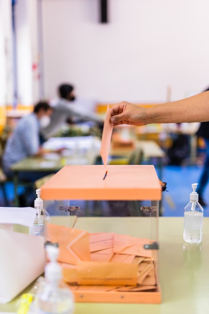 Autonomous community of madrid elections democraty referendum for government vote hand posing an env...