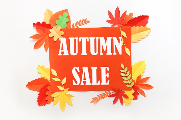 Photo autum sale. discount banner or flyer design template with paper autumn leaves on white kraft card