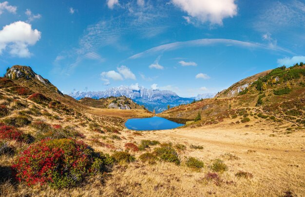 Autumn alpine Kleiner Paarsee or Paarseen lake Land Salzburg Austria Alps Hochkonig rocky mountain group view in far