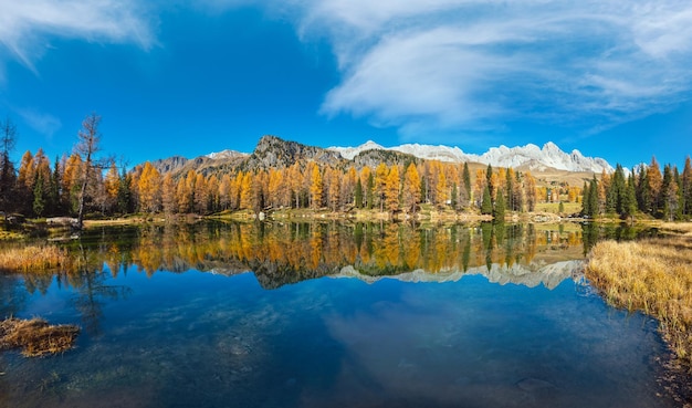 Autumn alpine mountain lake near San Pellegrino Pass Trentino Dolomites Alps Italy