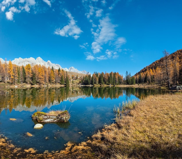 Autumn alpine mountain lake near San Pellegrino Pass Trentino Dolomites Alps Italy