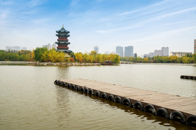 In autumn, ancient buildings and arch bridges are in Yingze Park, Taiyuan