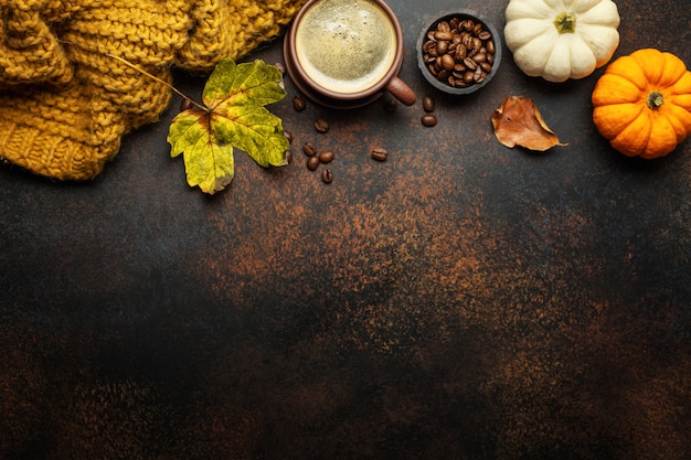 Autumn arrangement with coffee and pumpkin