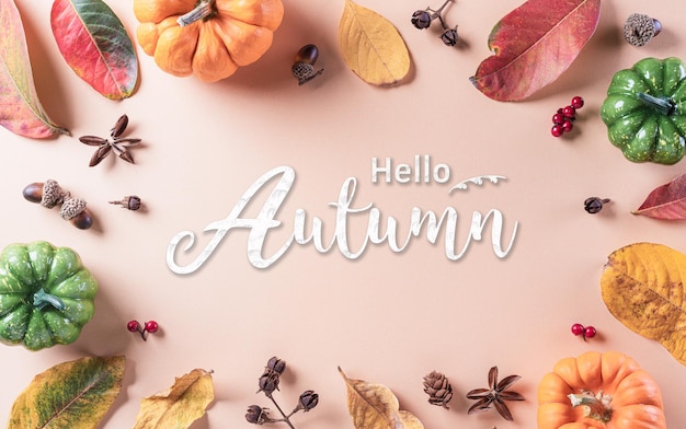 Autumn background decor from dry leaves and pumpkin on pastel paper background Flat lay top view with copy space for Autumn fall Thanksgiving concept