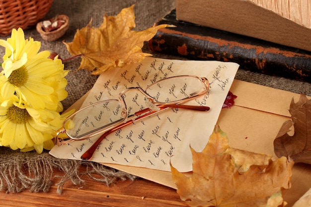 Autumn backgroundromantic letter glasses and leaves