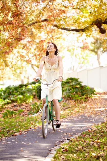 Autumn beauty. Shot of an attractive young woman in the park on an autumn day.