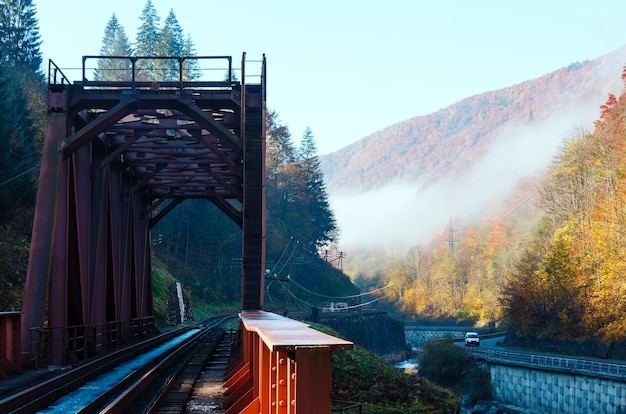 Autumn Carpathian mountains railroad bridge and river Ukraine