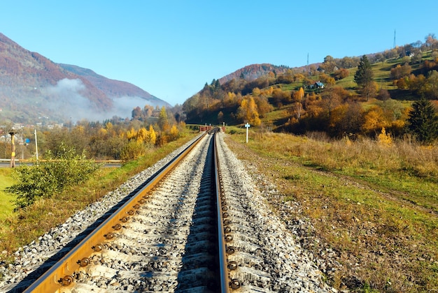 Autumn Carpathian mountains and railroad bridge Ukraine