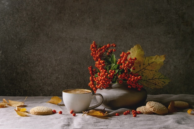 Autumn coffee with yellow leaves