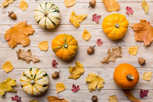 Autumn composition Pattern made of dried leaves and other design accessories on table Flat lay top view