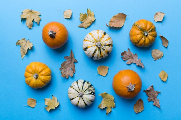 Autumn composition Pattern made of dried leaves and other design accessories on table Flat lay top view