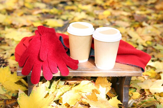 Autumn composition with hot beverage on nature background