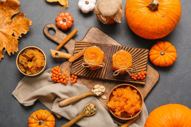 Autumn composition with tasty pumpkin jam