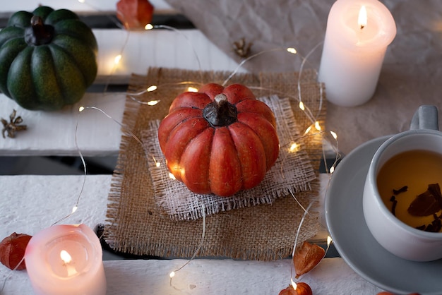 Autumn decor of pumpkins and candles in october idea for halloween