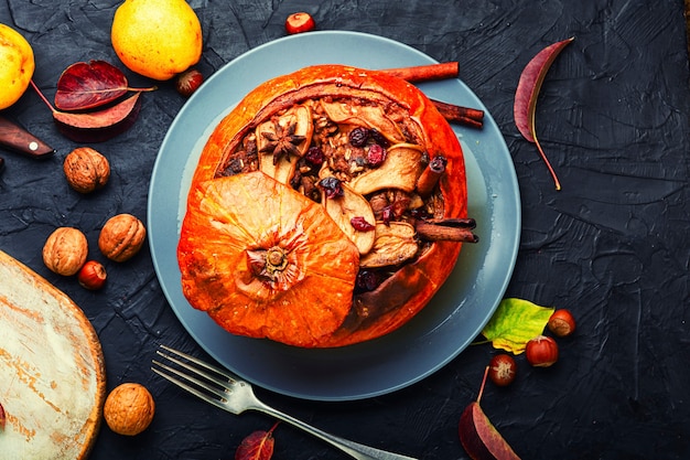 Autumn dessert, pumpkin stuffed with dried fruits