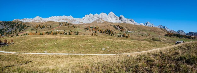 Autumn dolomites mountain tops panoramic view from san pellegrino pass environs trentino dolomites alps italy picturesque traveling seasonal and nature beauty concept scene