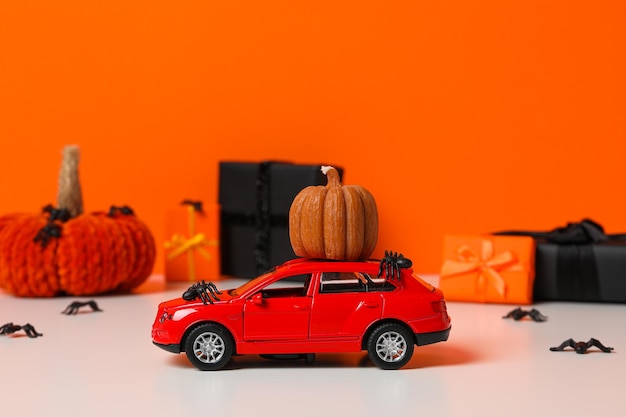 Autumn or fall travel and vacation concept with car