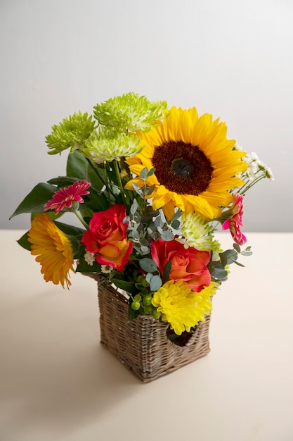 Autumn flowers bouquet from gerber and sunflowers neutral warm background