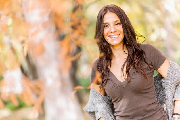 Woman in white knit sweater holding yellow maple leaf photo – Free Plant  Image on Unsplash