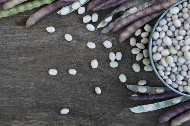 Autumn harvest of beans on a wooden table