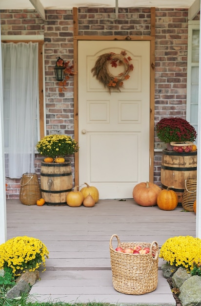 Autumn harvest terrace background. Halloween. Country. Pumpkins and flowers. Vacation home. Thanksgiving Day