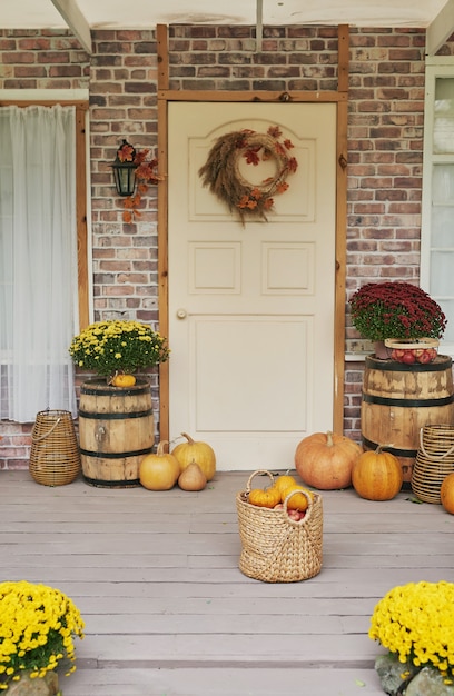 Autumn harvest terrace background. Halloween. Country. Pumpkins and flowers. Vacation home. Thanksgiving Day