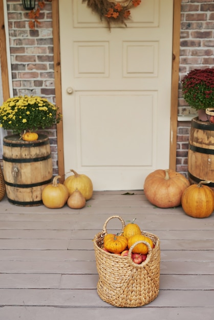 Autumn harvest terrace background. Halloween. Country. Pumpkins and flowers. Vacation home. Thanksgiving Day