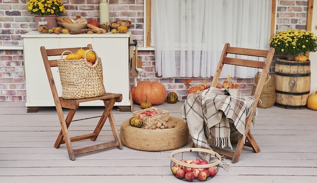 Autumn harvest terrace background. Halloween. Country. Pumpkins and flowers. Vacation home. Thanksgiving Day