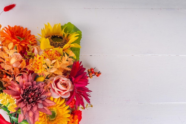 Autumn holidays greeting card background Autumn red orange bright flowers and leaves a big bouquet on a background case Teacher's Day Thanksgiving Day Halloween background