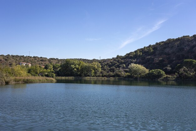 Autumn landscape with lake on a sunny day