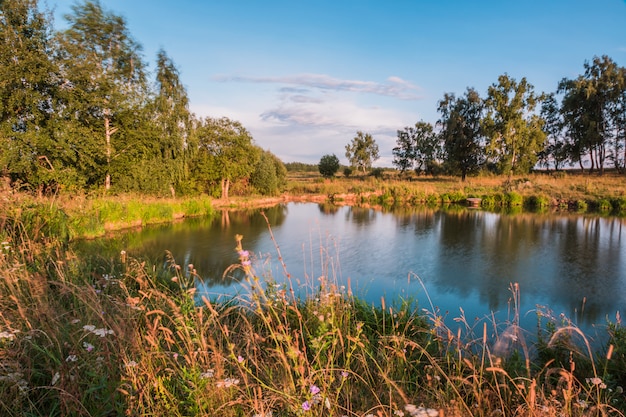 Autumn Landscape with  small  lake in a forest, nature scene at sunset, Russia.