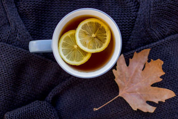 Autumn layout with hot tea with lemon