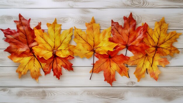 an autumn leaf is laying on a wooden background