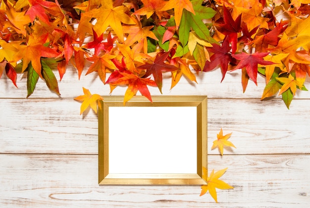 Autumn leaves and golden frame with space for your picture or text