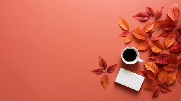 Autumn leaves on the red table with cup of coffee and notebook flat lay