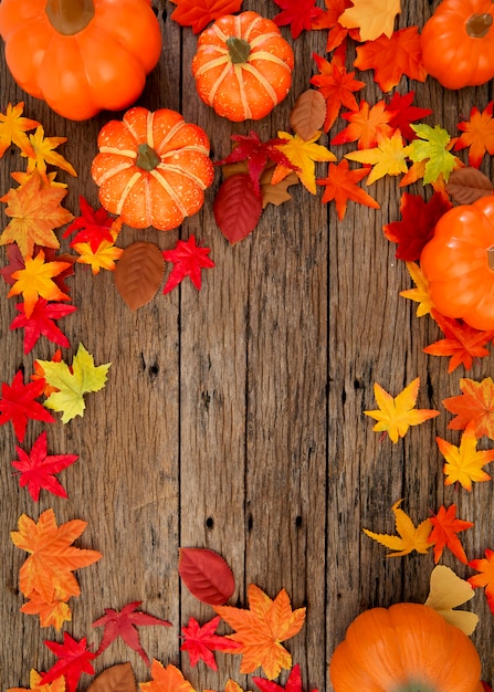 Autumn leaves on wooden background