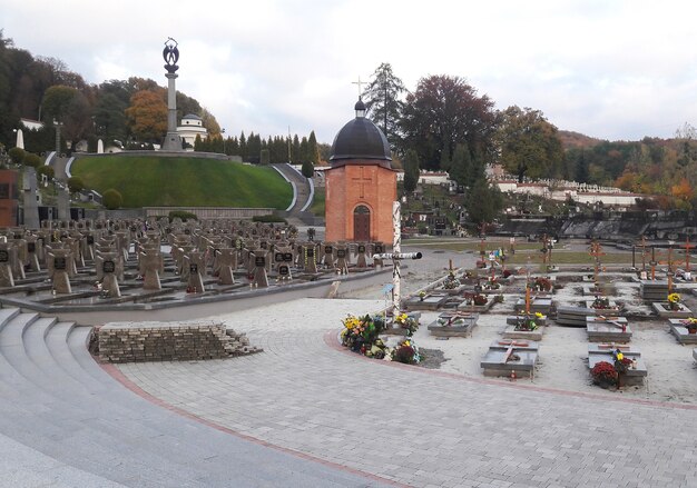 Autumn old cemetery with a chapel and rows of monuments