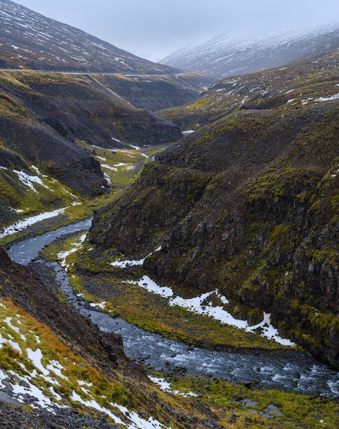 Autumn overcast day in the north of Iceland Small river flowing through beautiful canyon