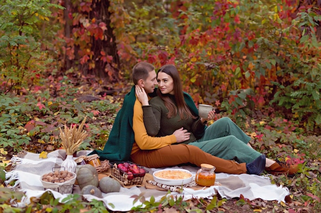 Autumn picnic with pumpkin, apples, tea