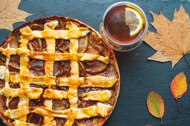 autumn pie with apples and shortbread baking dessert sweets and cup of tea coziness atmosphere