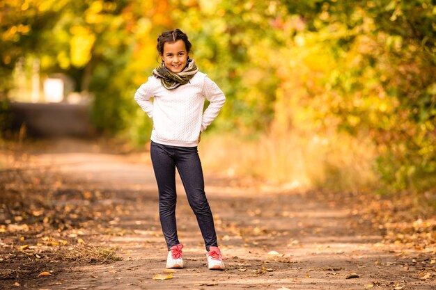 Autumn portrait of cute little caucasian girl