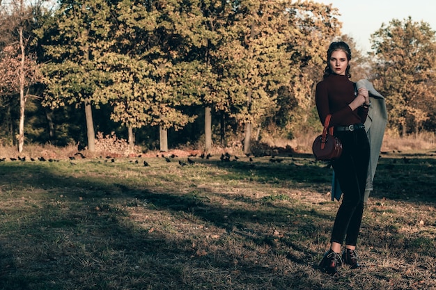 Autumn portrait shooting of a stylish girl