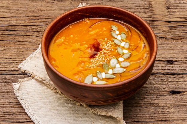 Autumn pumpkin cream soup. Traditional ingredients, healthy food concept. 